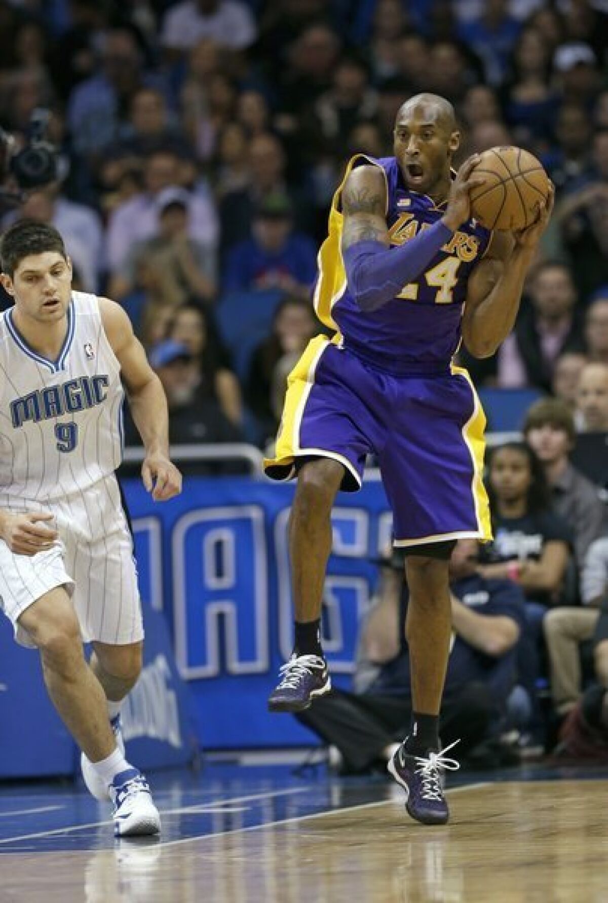 Lakers guard Kobe Bryant grabs a rebound against the Orlando Magic.