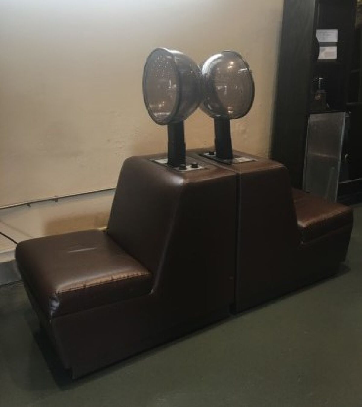 Hair drying stations at Lynnel’s Hair Design are set back to back to keep customers socially distant.