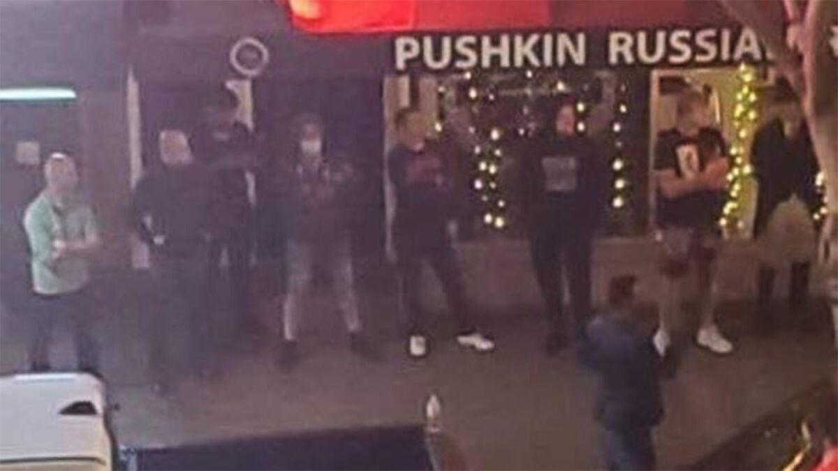 Gazaryan's friends stand guard outside Pushkin Russian Restaurant Sunday night.