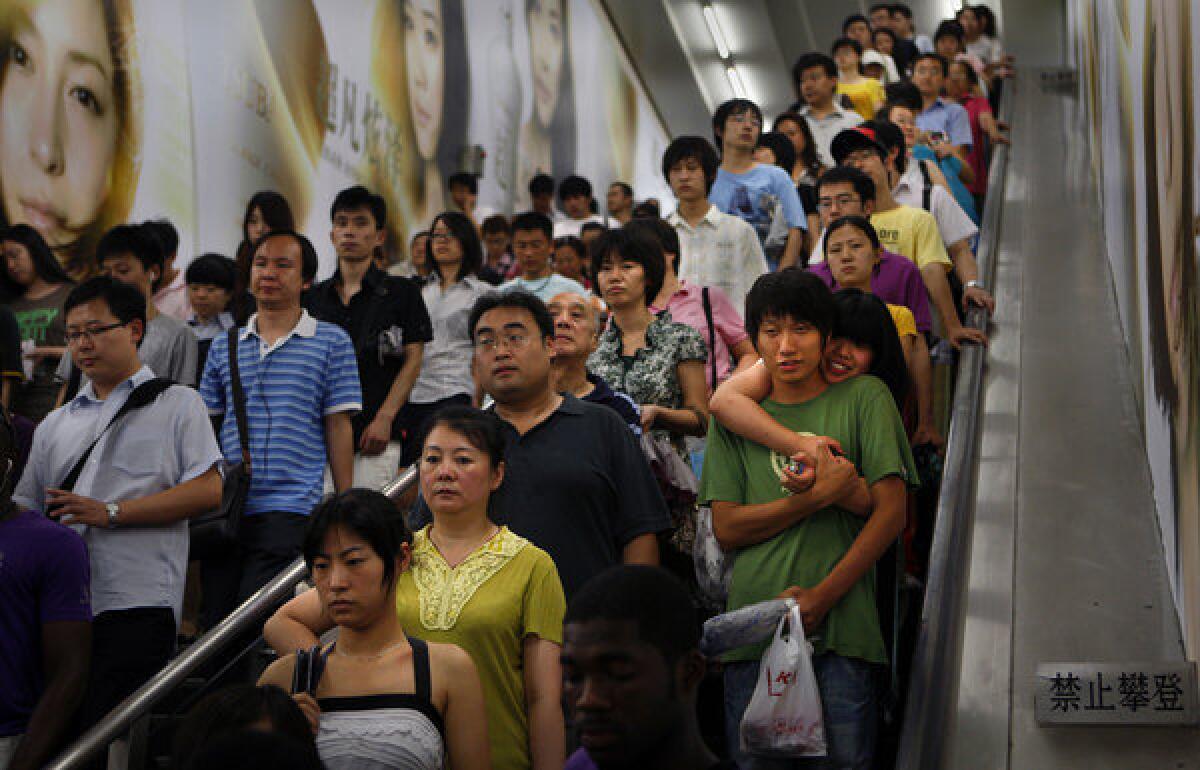 Beijing's subway system is a microcosm of the crowded capital. Nearly one-fifth of humanity lives in China.