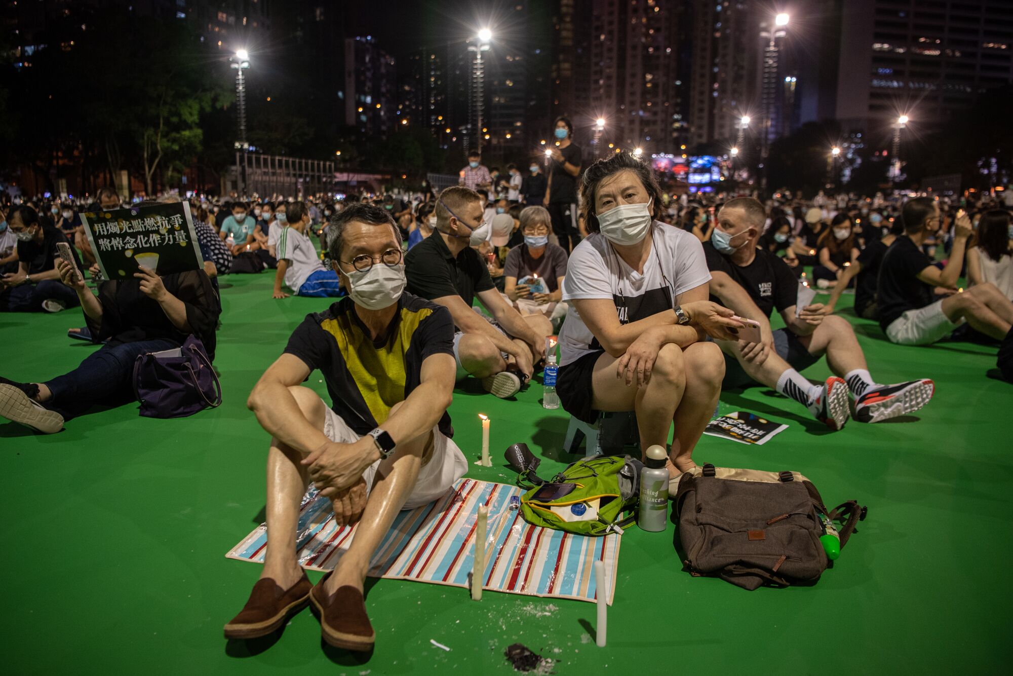 Hong Kong couple attend a banned commemoration of the Tiananmen Square anniversary.