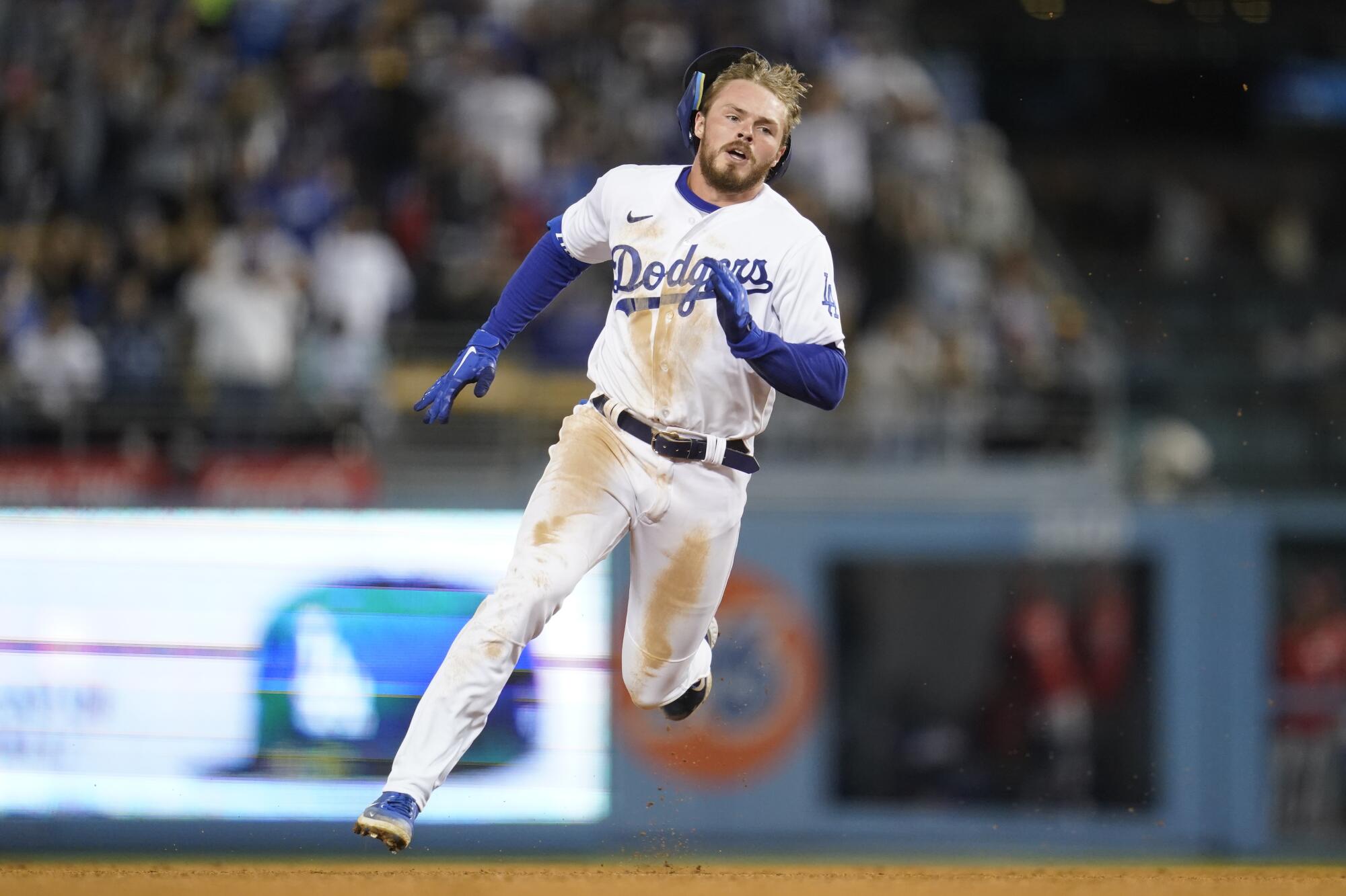 Los Angeles Dodgers' Gavin Lux runs to third on a triple during the fifth inning.