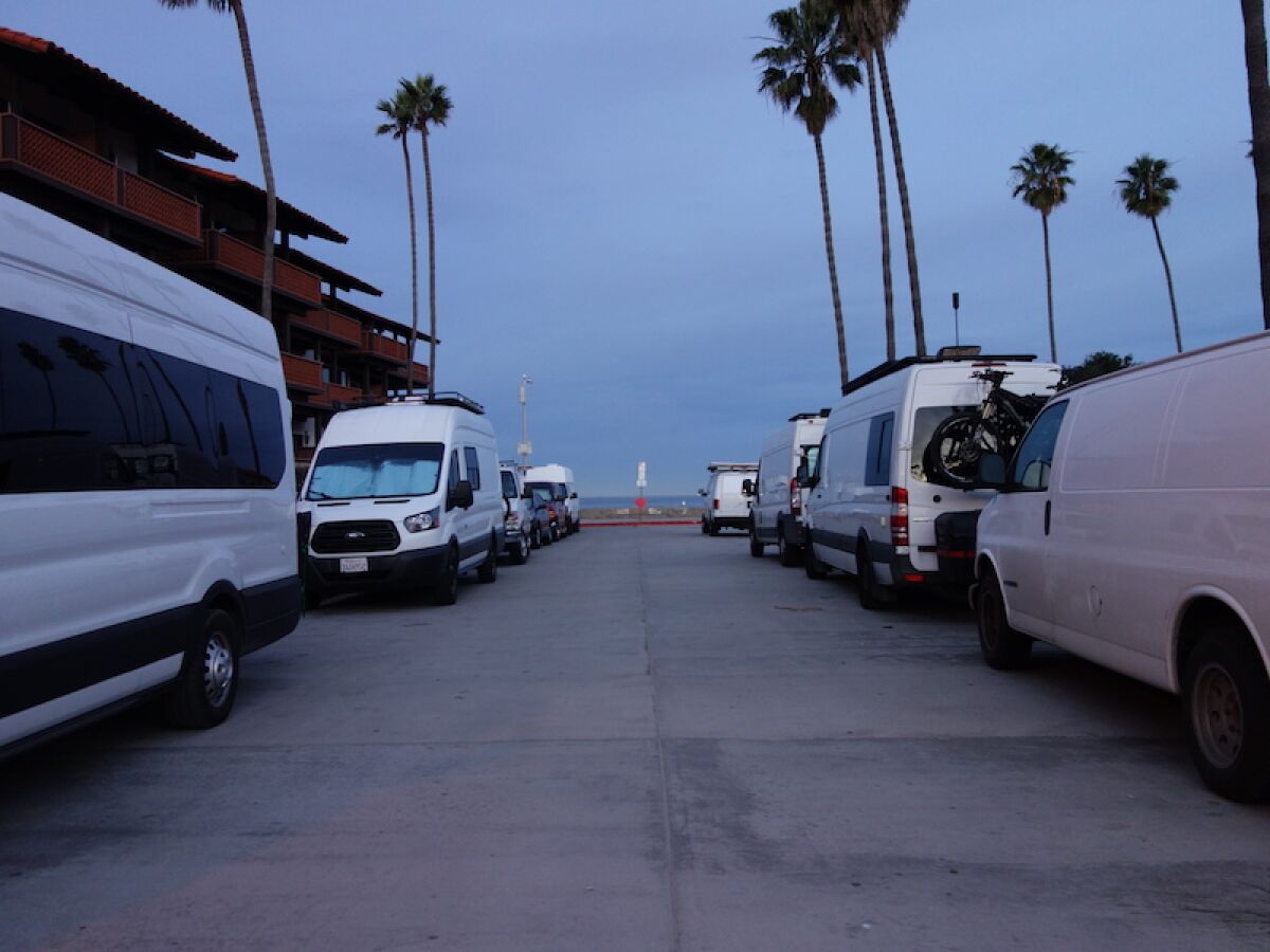 Parked vans line Vallecitos in La Jolla Shores on a January morning.