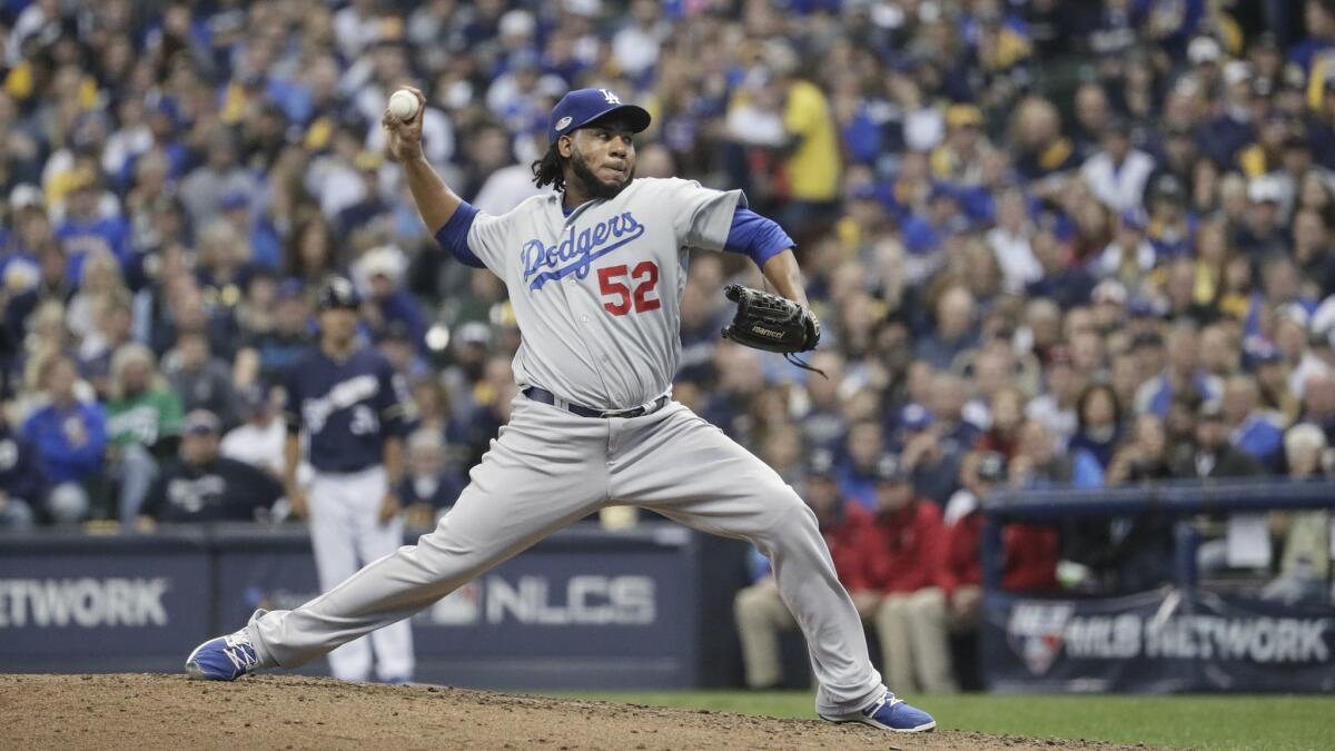 Dodgers reliever Pedro Baez pitches against the Milwaukee Brewers.