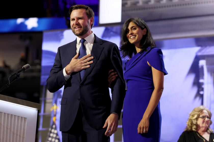 MILWAUKEE, WI JULY 17, 2024 --- Republican vice presidential candidate Sen. J.D. Vance and his wife Usha Chilukuri Vance during the Republican National Convention on Wednesday, July 17, 2024. Vance's mom Beverly back right. (Robert Gauthier / Los Angeles Times)