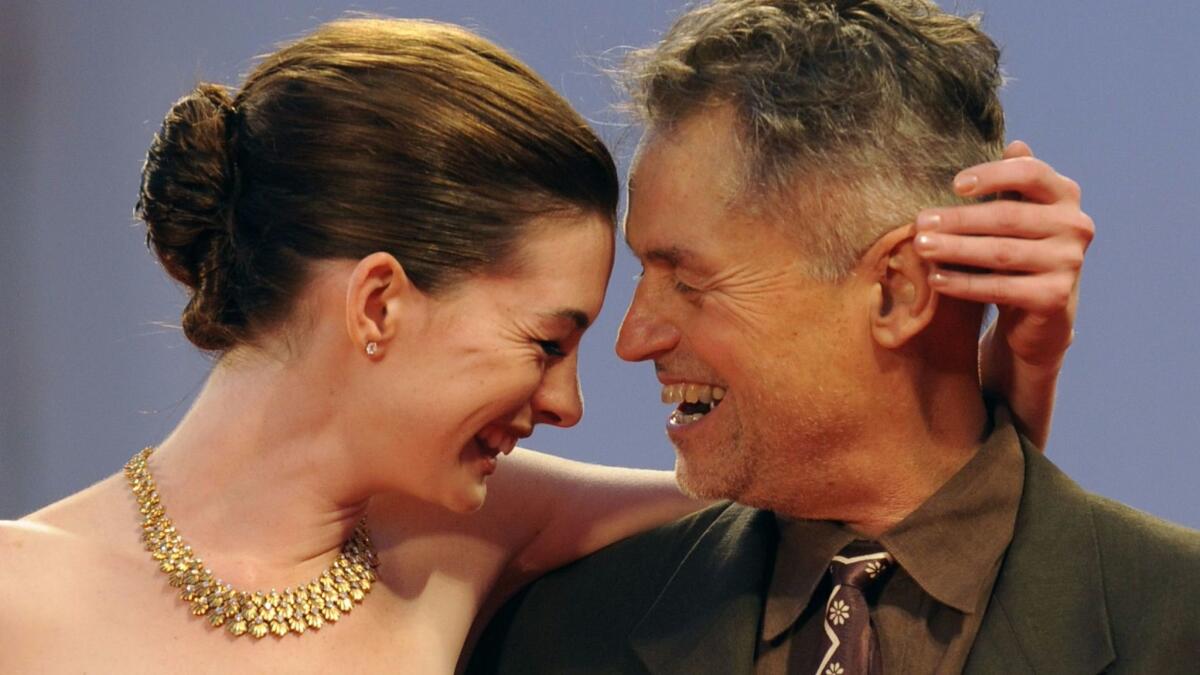 Jonathan Demme, right, with Anne Hathaway before a screening of "Rachel Getting Married" at the 2008 Venice International Film Festival. (Damien Meyer / AFP/Getty Images)