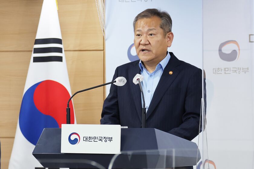 Lee Sang-min, Minister of the Interior and Safety, center, speaks at the government complex in Seoul, South Korea, Thursday, Oct. 6, 2022. South Korea’s opposition-controlled parliament on Wednesday, Feb. 8, 2023, voted to impeach Lee, him responsible for government failures in disaster planning and the response that likely contributed to the high death toll of a crowd crush that killed nearly 160 people in October. (Kim Seung-doo/Yonhap via AP)