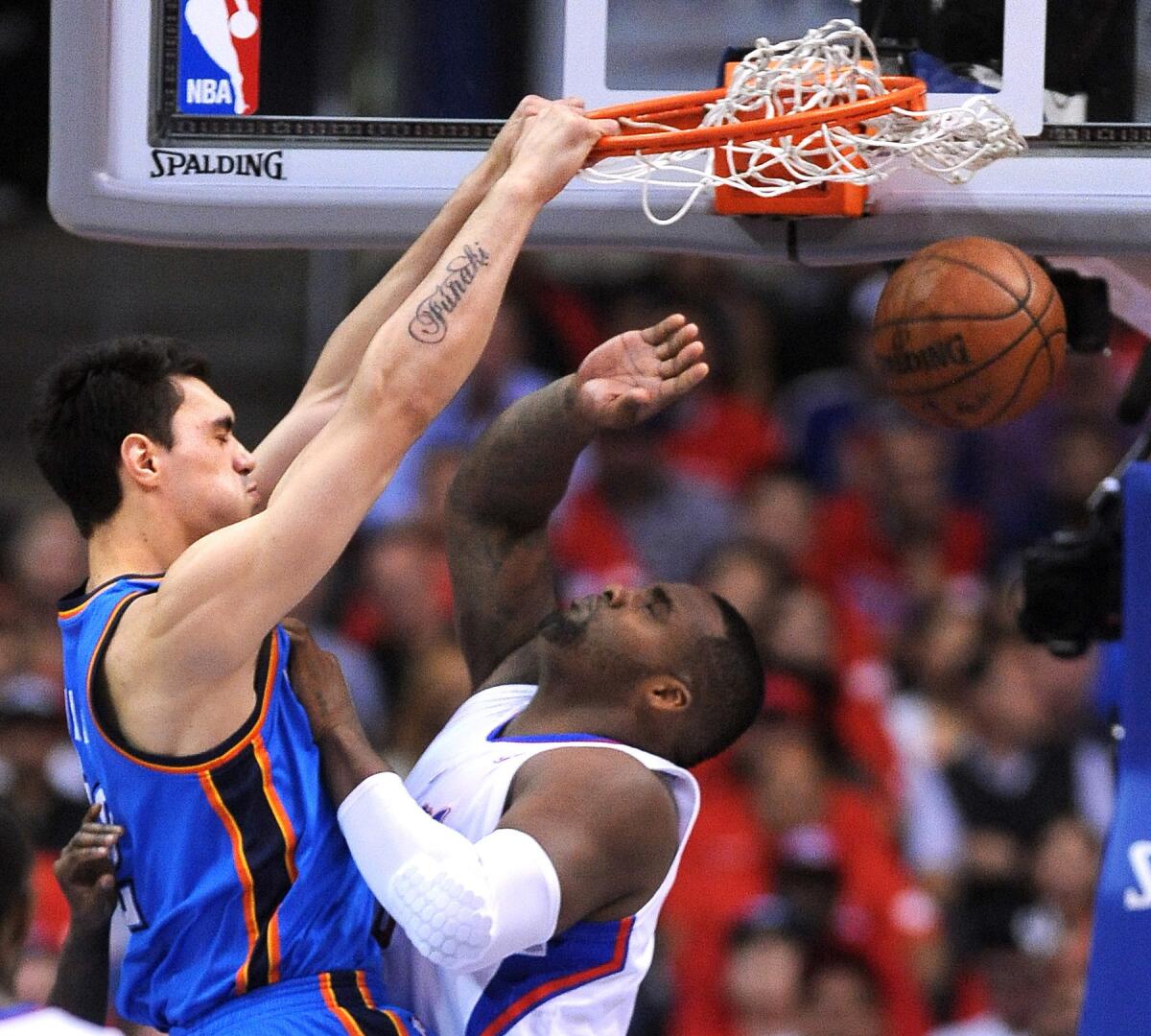 Steven Adams of the Thunder dunks over Clipper Glen Davis in Game 3 of the NBA Western Conference playoffs in May.