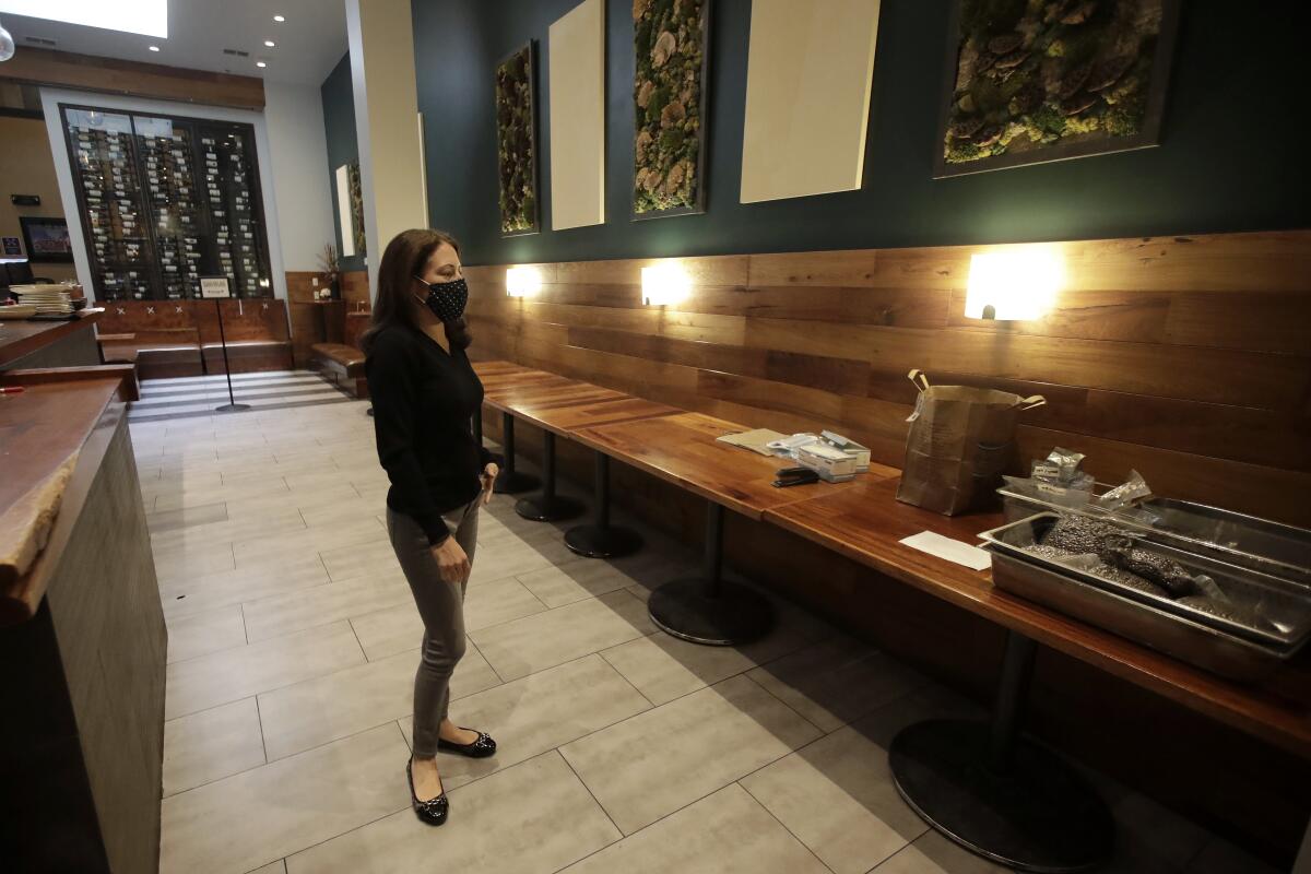 Sarah Trubnick, owner of the Barrel Room, stands inside her restaurant in July.