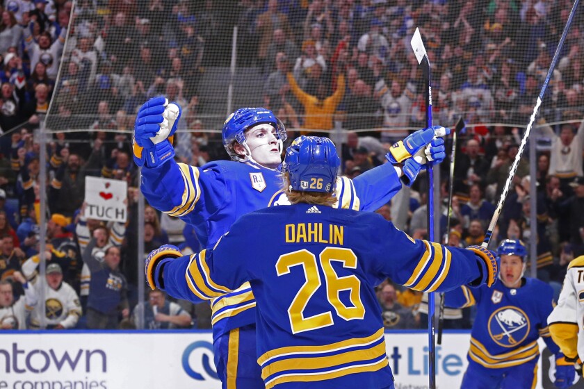 Buffalo Sabres right wing Tage Thompson, left, celebrates his goal with defenseman Rasmus Dahlin (26) during the first period of an NHL hockey game against the Nashville Predators, Friday, April 1, 2022, in Buffalo, N.Y. (AP Photo/Jeffrey T. Barnes)