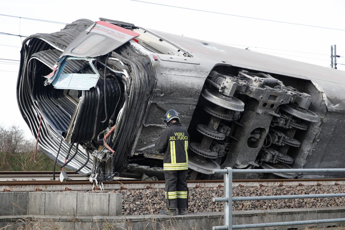 A firefighter at the scene of a train derailment near Lodi, Italy, on Thursday.