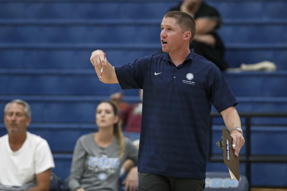 Corona del Mar coach Sam Stafford instructs his players from the sideline against Trabuco Hills in a nonleague match on Thursday.