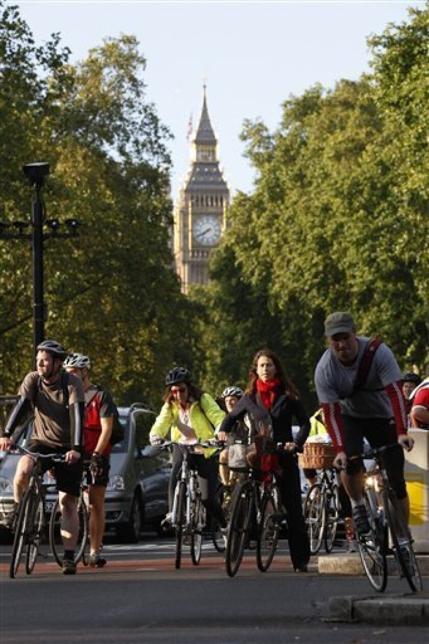 Cyclists wait at a junction on the Embankment in London, Tuesday, Sept. 7, 2010. Millions of Londoners are struggling to get to work by road, rail boat and bicycle as a strike by London Underground workers shuts down much of the city's subway system. (AP Photo/Sang Tan)
