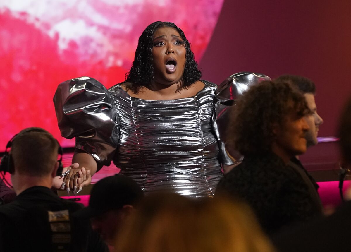 Lizzo accepts the award for record of the year for "About Damn Time" at the 65th annual Grammy Awards on Sunday, Feb. 5, 2023, in Los Angeles. (AP Photo/Chris Pizzello)