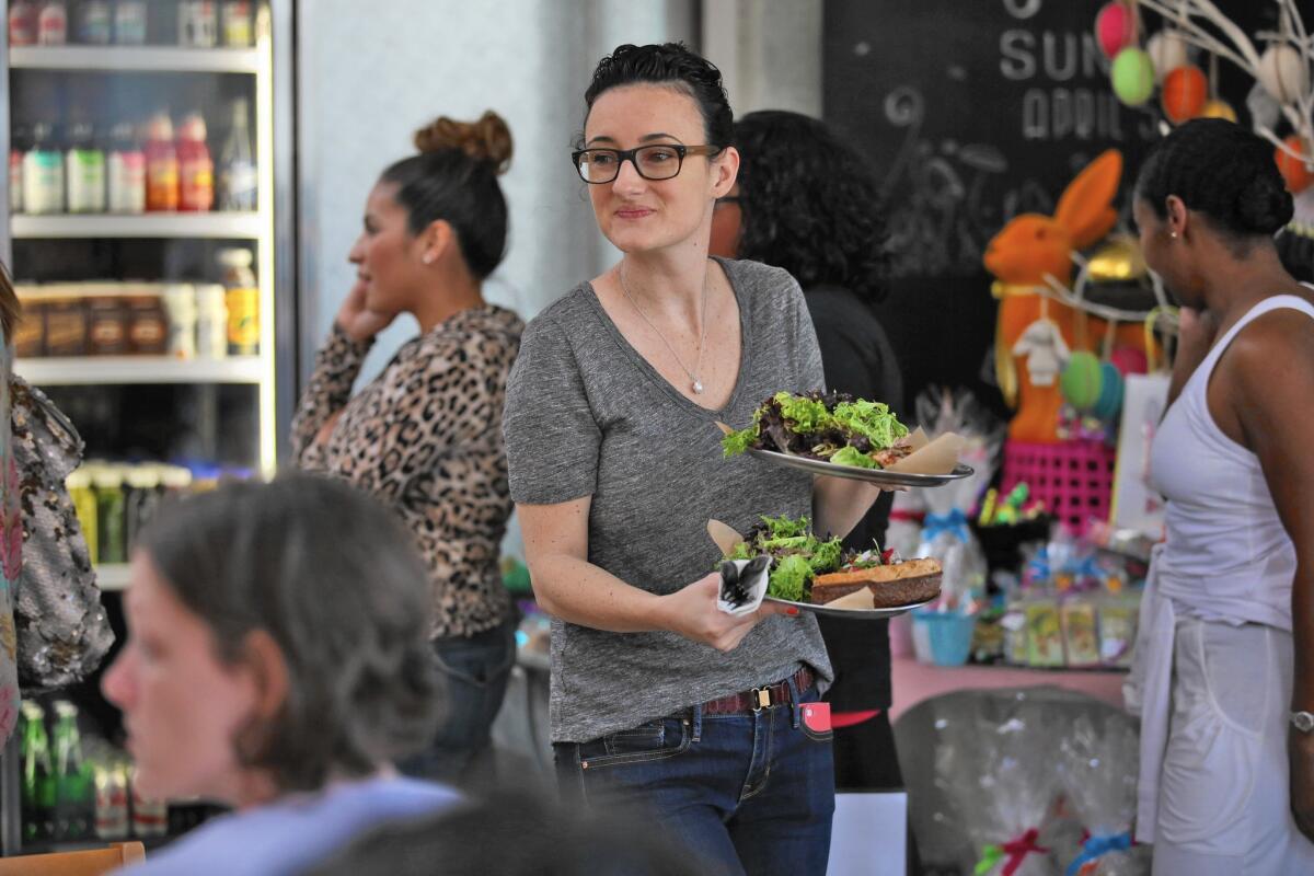 Holly Jones serves customers at a new restaurant on Lincoln Boulevard in northwest Pasadena.