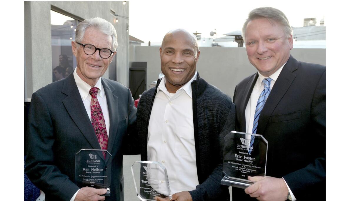 Among the outgoing board members honored for their service were Ken Nielsen, from left, Sunder Ramani, and Eric Foster.