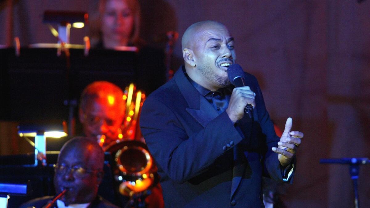 James Ingram performs during a Ray Charles tribute at the Beverly Hilton in 2004.