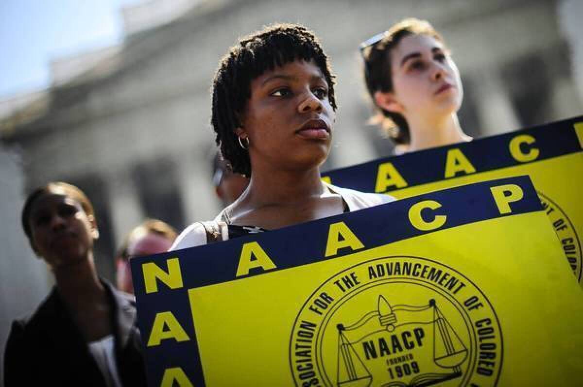 Jessica Pickens of Chicago and fellow civil rights advocates gather outside the Supreme Court in support of the Voting Rights Act.