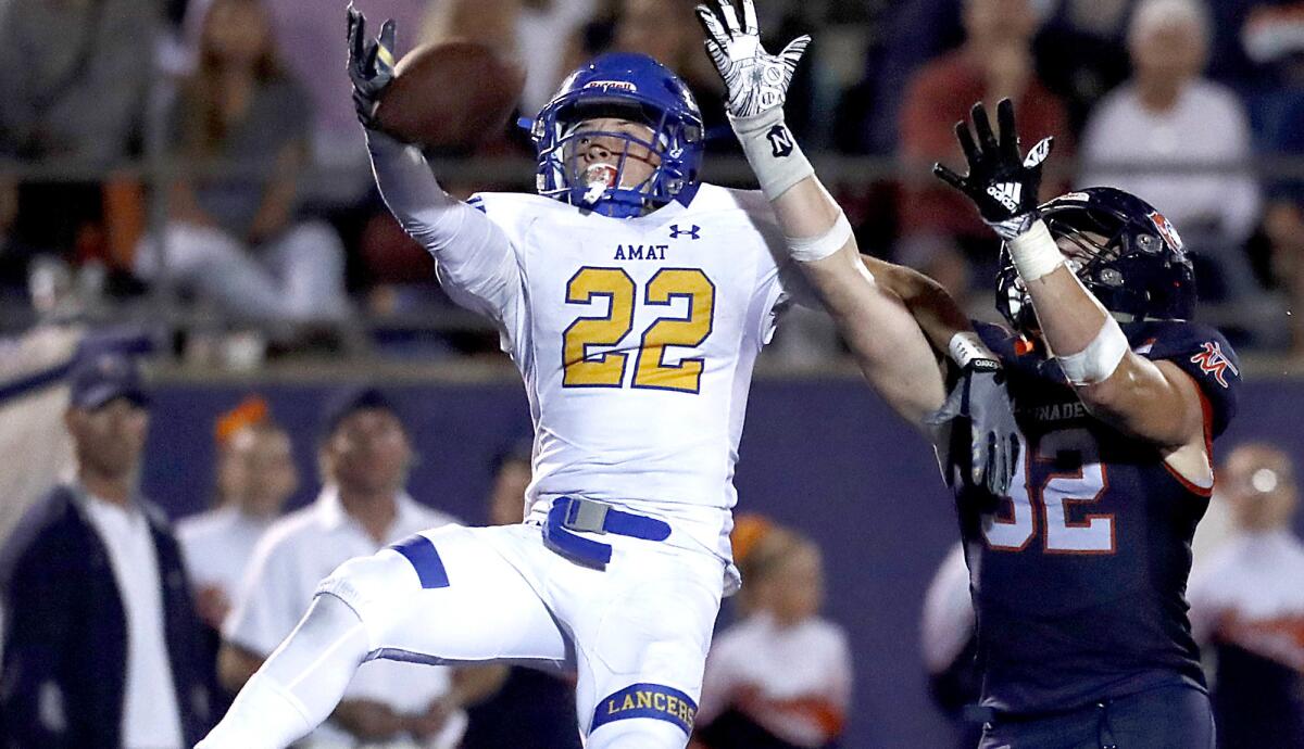 Bishop Amat cornerback Christopher Lopez breaks up a pass intended for Chaminade's Blake Antzoulatos during the second quarter Friday.