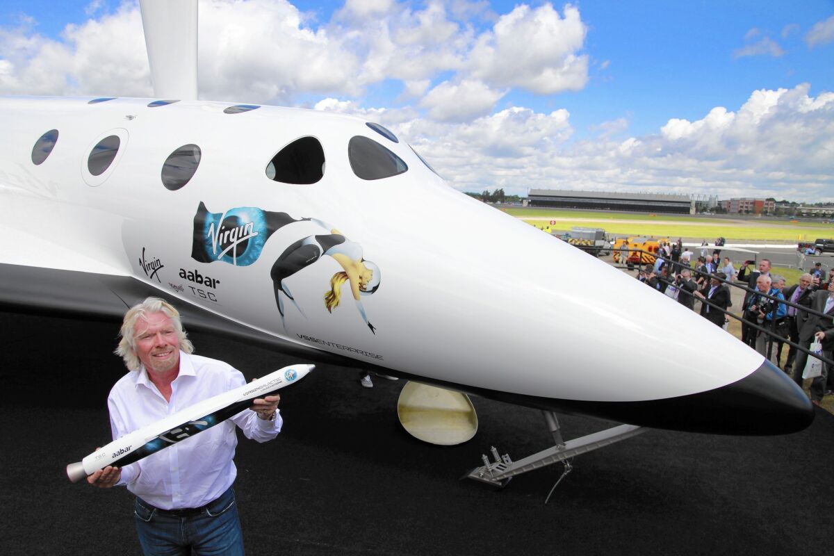 Workers at the new Long Beach facility will design and build Virgin Galactic’s satellite-launching rocket. Above, company founder Richard Branson in 2012.
