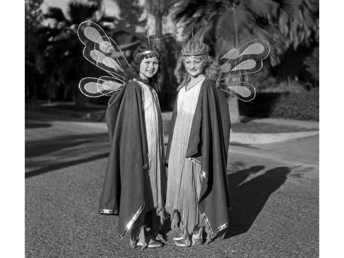 Jan. 2, 1933: Fairies Dorothy Jean Durand and Mary McCrory pose for a photographer before the Rose Parade. They rode on the "Pasadena Fairyland" float sponsored by the Pasadena Park Department.