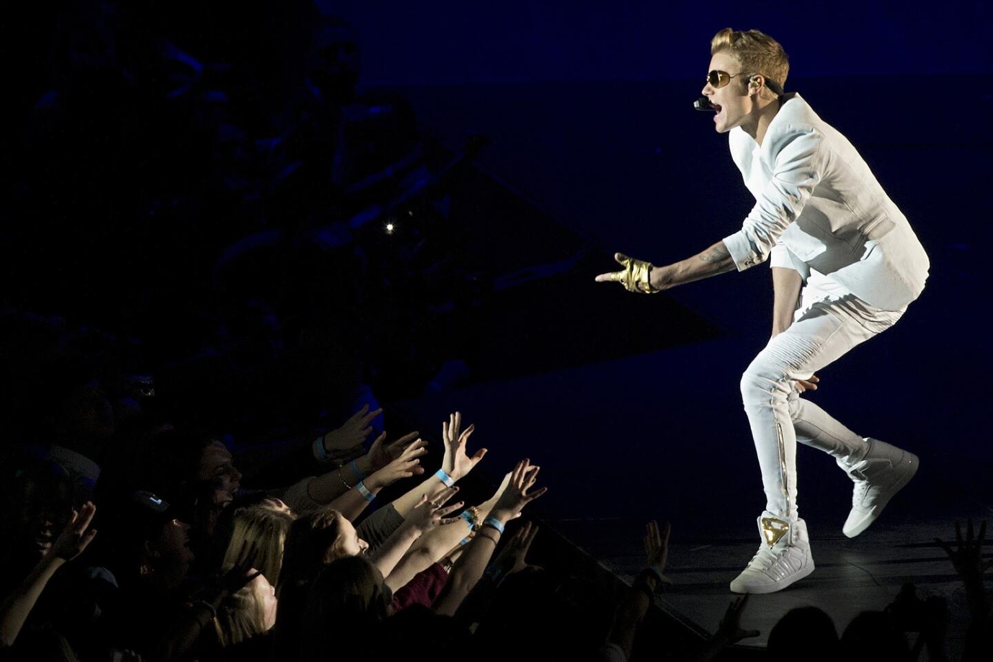 Justin Bieber collapsed Thursday night after suffering breathing problems while playing the third of four shows planned for London's O2 arena. After receiving oxygen from emergency personnel, the 19-year-old returned to finish his final four songs before heading to the hospital to be checked out. Bieber told the audience he wasn't feeling well before he stumbled backstage, according to TMZ and the Daily Mail. He fainted backstage, not onstage, his rep told the Associated Press. He still intended to play the fourth and final London show Friday night, according to his Twitter feed. Full story: Justin Bieber collapses at London concert, returns to finish show