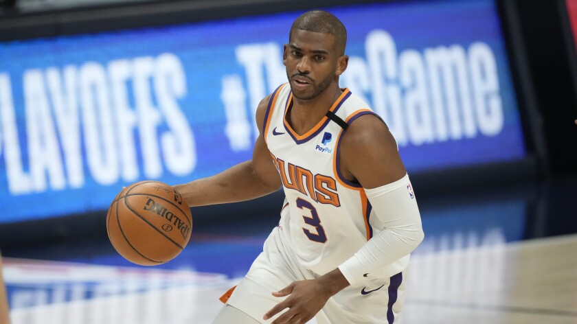 Phoenix Suns guard Chris Paul dribbles the ball during the first half of Game 4 