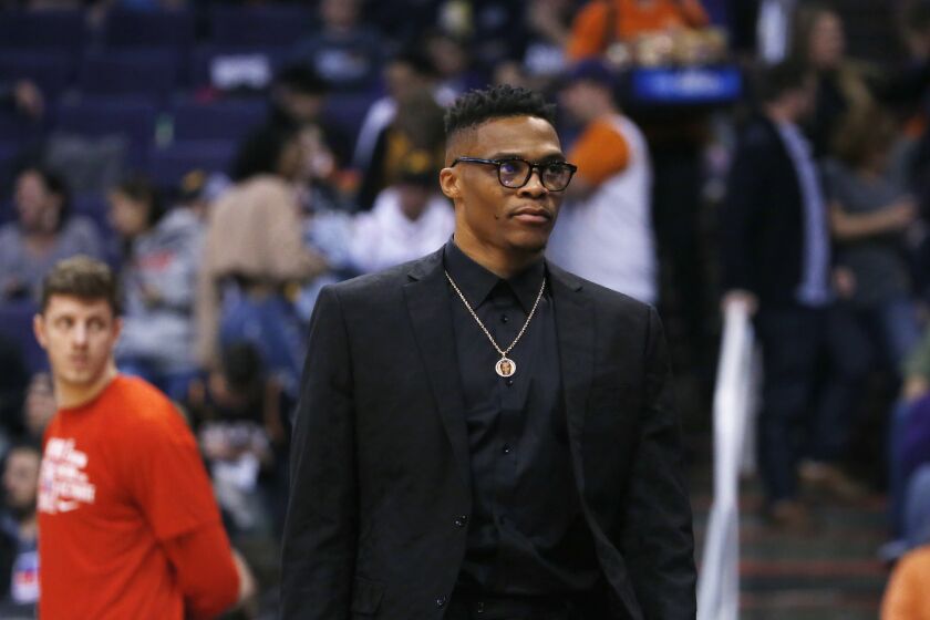 Houston Rockets guard Russell Westbrook leaves the bench area and walks back to the locker room during the first half of an NBA basketball game against the Phoenix Suns, Friday, Feb. 7, 2020, in Phoenix. (AP Photo/Ross D. Franklin)
