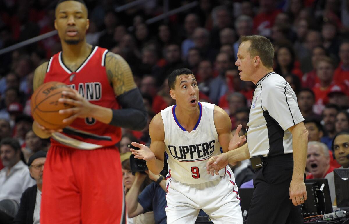 Clippers guard Pablo Prigioni (9) can't believe he was whistled by referee Bill Spooner him for a foul on Portland Trail Blazers guard Damian Lillard, left, during Game 5 of the first-round Western Conference playoff series on Wednesday.