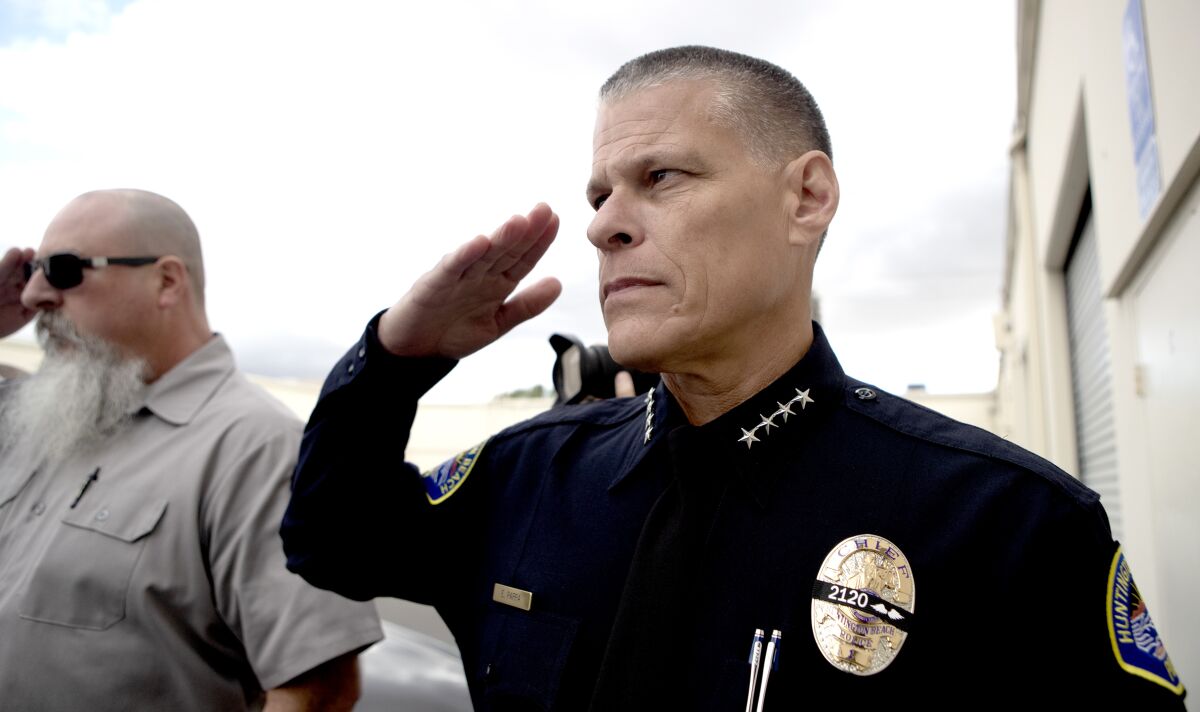 Huntington Beach Police Chief Eric Parra salutes
