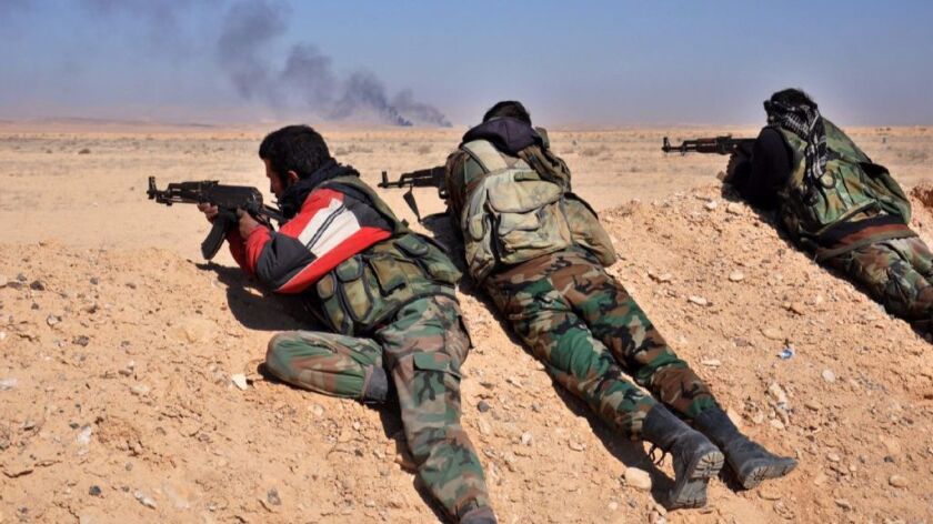 Syrian regime forces fire towards Islamic State group positions as they advance towards Hayyan oil field, east of the central Syrian Homs province on February 7, 2017.