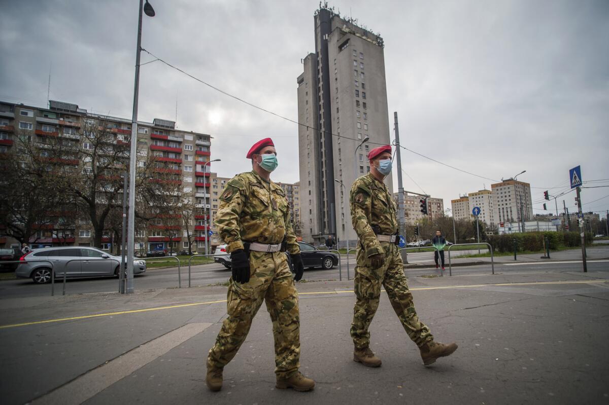 Two military police officers patrol the streets in Budapest, Hungary.