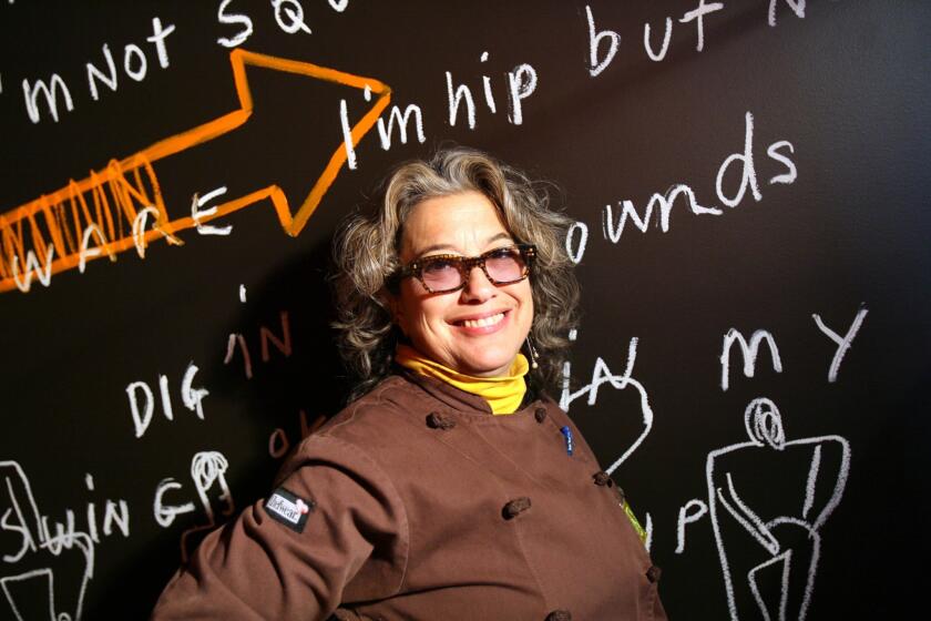 Chef Susan Feniger poses for photographs at her now-closed restaurant Street. Feniger is turning the space into a new restaurant called Mud Hen Tavern.