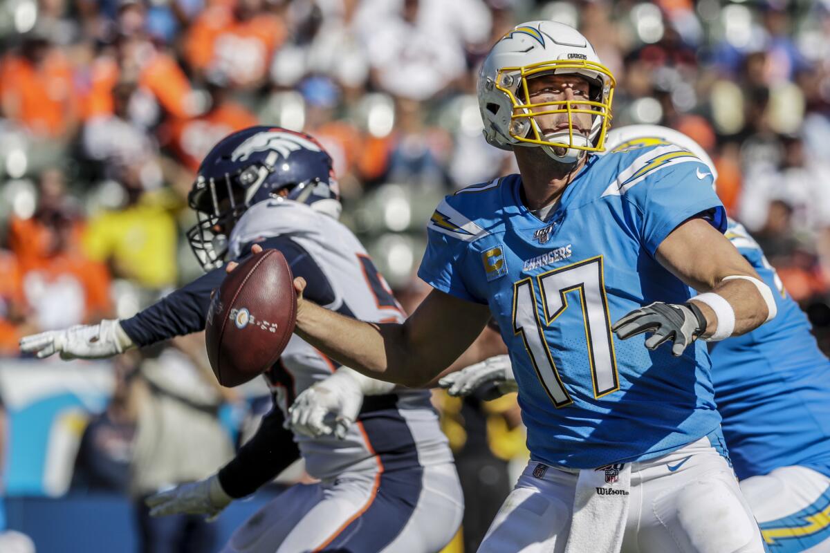 Chargers quarterback Philip Rivers steps up in the pocket to unload a pass against the Broncos on Sunday.