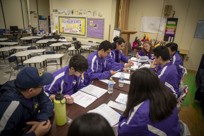 BELL, CALIF. -- WEDNESDAY, MARCH 11, 2020: Bell High School Academic Decathlon students attend a study session at Bell High School in Bell, Calif., on March 11, 2020. The students studied the great pandemics of world history to beat the odds and win the local academic decathlon. Now they are witnessing an actual pandemic outbreak that threatens to shut down next round of competition at the state level. (Allen J. Schaben / Los Angeles Times)