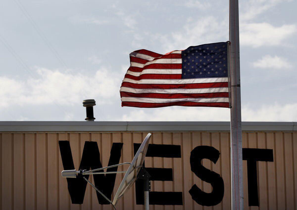 A flag is flown at half staff in West, Texas, near the fertilizer plant that exploded Wednesday night in the town of 2,800.