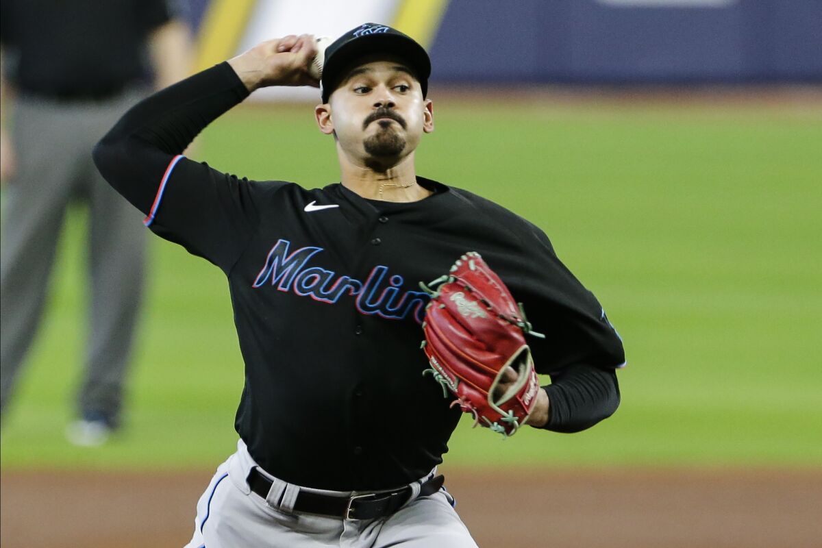 Miami Marlins' Pablo Lopez delivers a pitch during the second inning in Game 2 of a baseball National League Division against the Atlanta Braves Series Wednesday, Oct. 7, 2020, in Houston. (AP Photo/Michael Wyke)