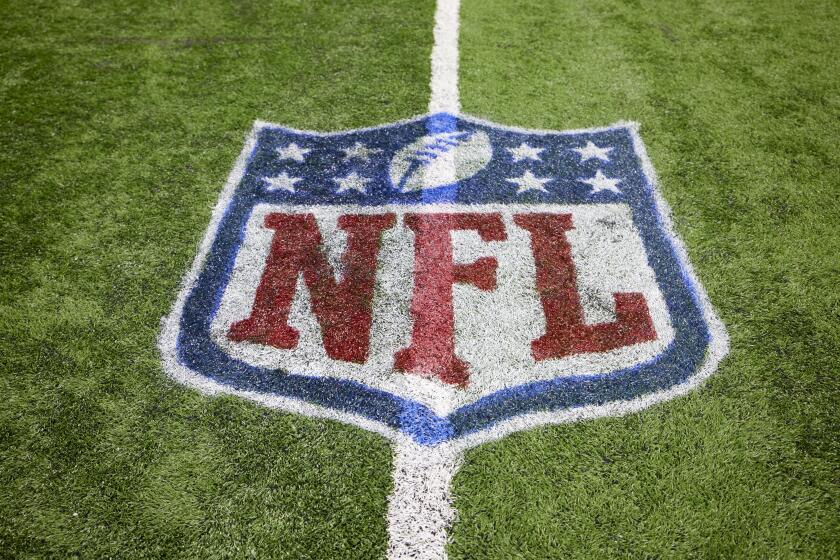 The NFL logo is shown on the field during a game Dec. 5, 2021, in Detroit.