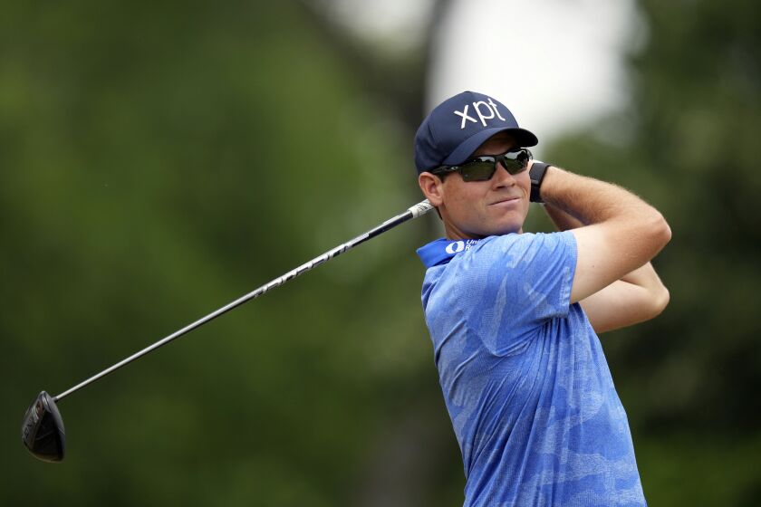 Adam Schenk hits a tee shot on the third hole during the third round of the Charles Schwab Challenge golf tournament at Colonial Country Club in Fort Worth, Texas, Saturday, May 27, 2023. (AP Photo/LM Otero)