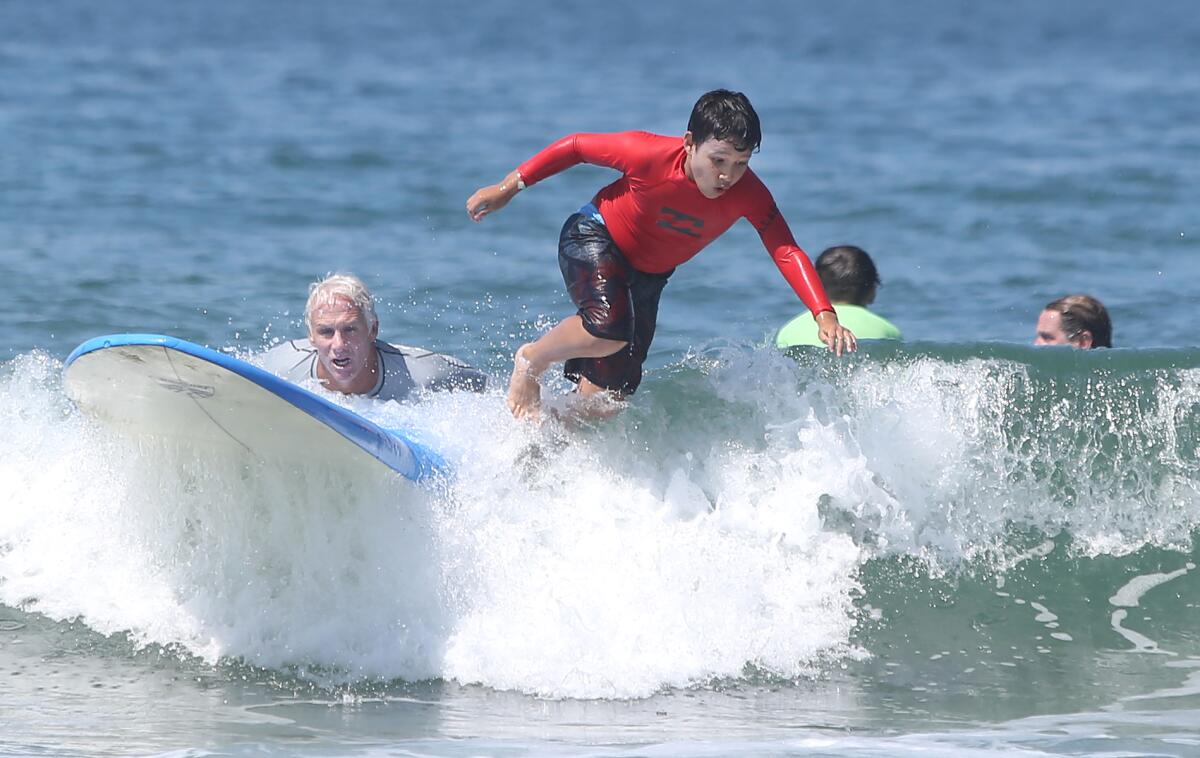 Critically ill children find respite in the surf during Miracles for Kids  camp - Los Angeles Times