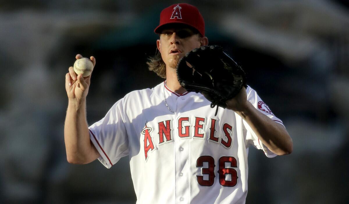 Angels starting pitcher Jered Weaver asks for time during his last start.