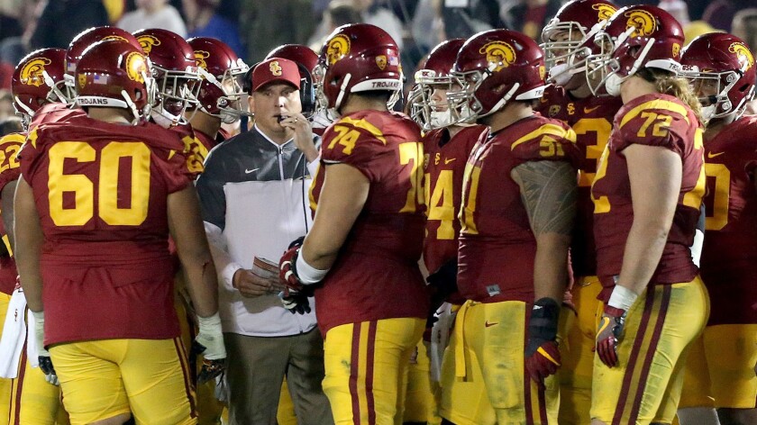 USC coach Clay Helton during a timeout with players.