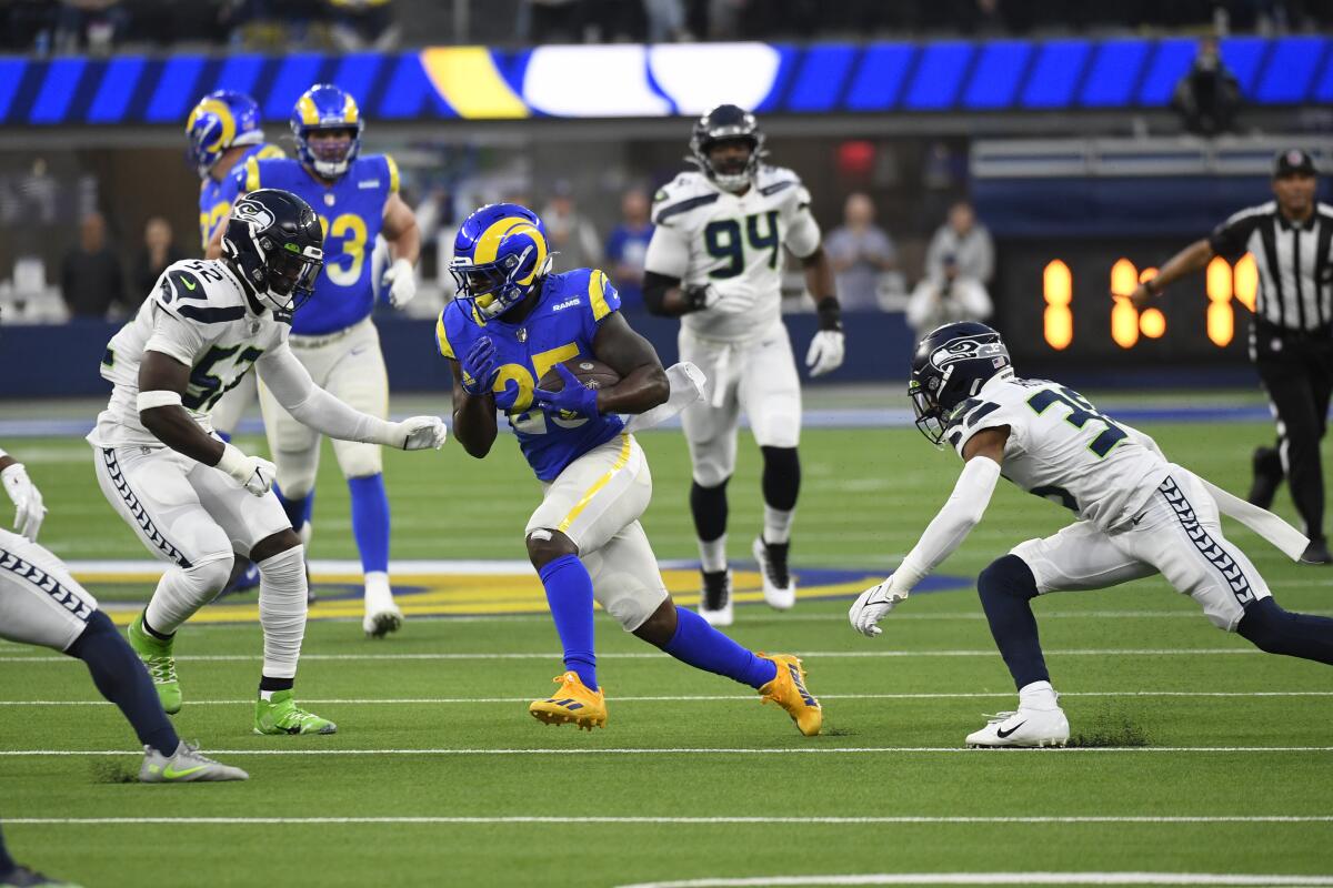 Rams running back Sony Michel carries the ball against the Seahawks in the first half.