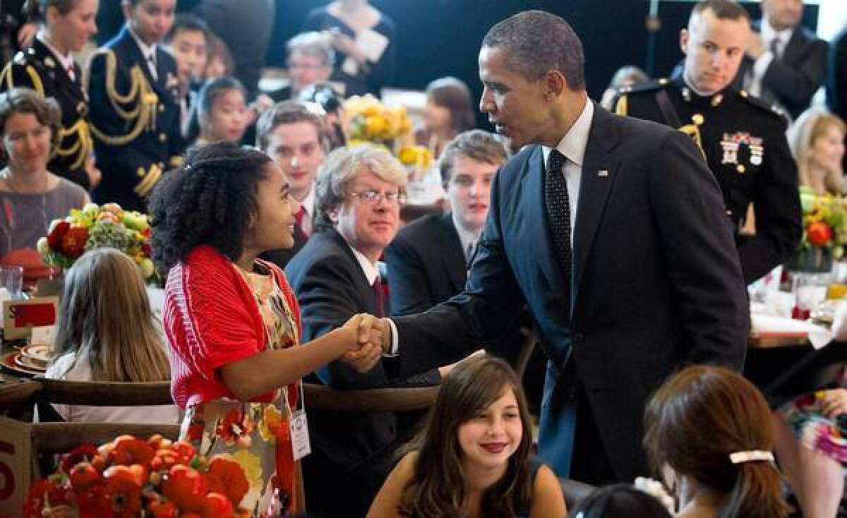 President Obama greets guests of a "Kids' State Dinner" last week hosted by First Lady Michelle Obama. The president has said he counts his failure to bridge the nation's partisan gap as one of his biggest frustrations.