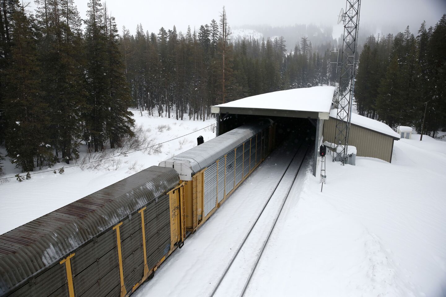 The train passes under an avalanche tunnel near the Sugar Bowl Ski Resort, in Norden, Calif., on Jan. 7, 2017.
