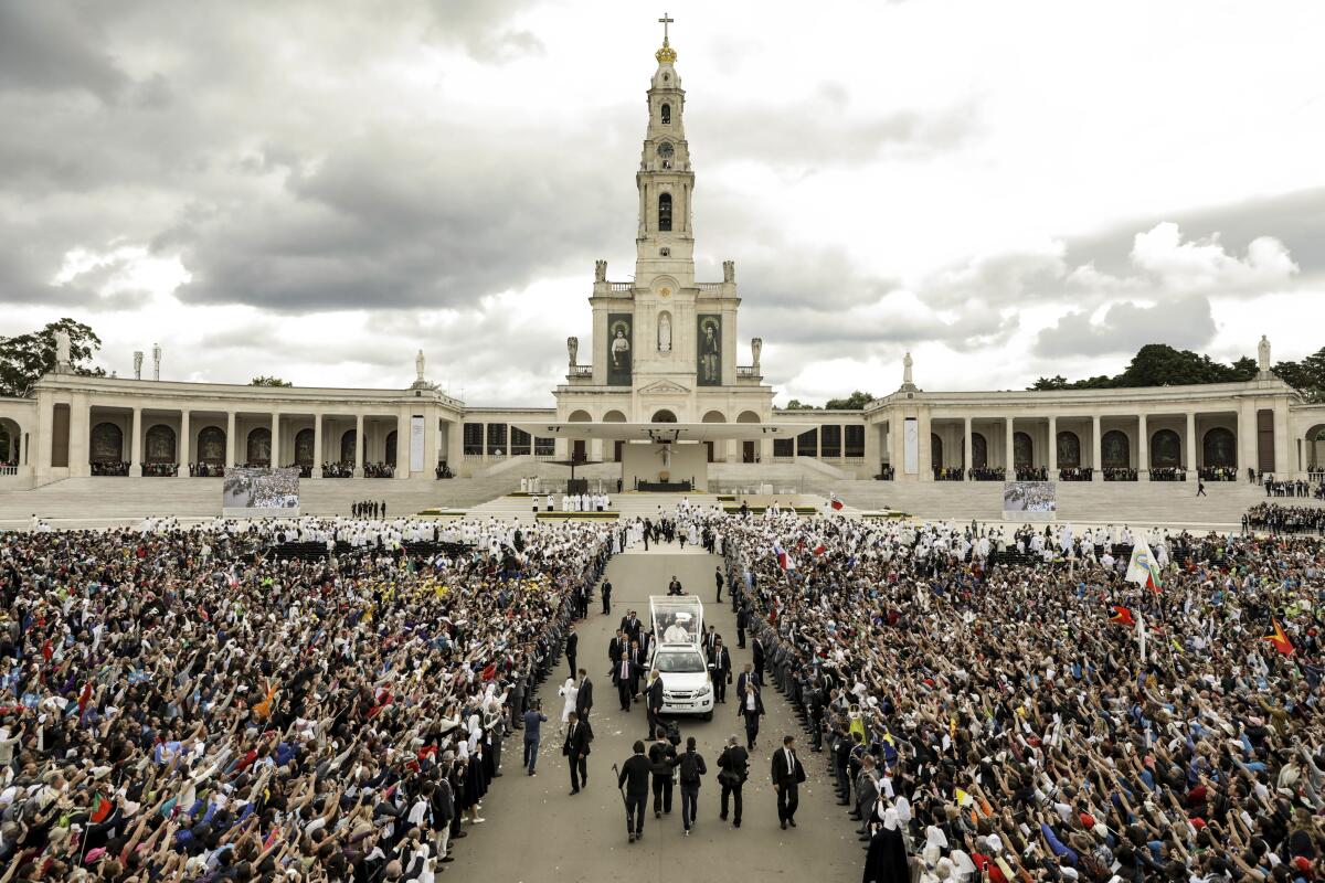 Pope Francis in his popemobile leaves the Sanctuary of Our Lady of Fatima, in Fatima, Portugal. 