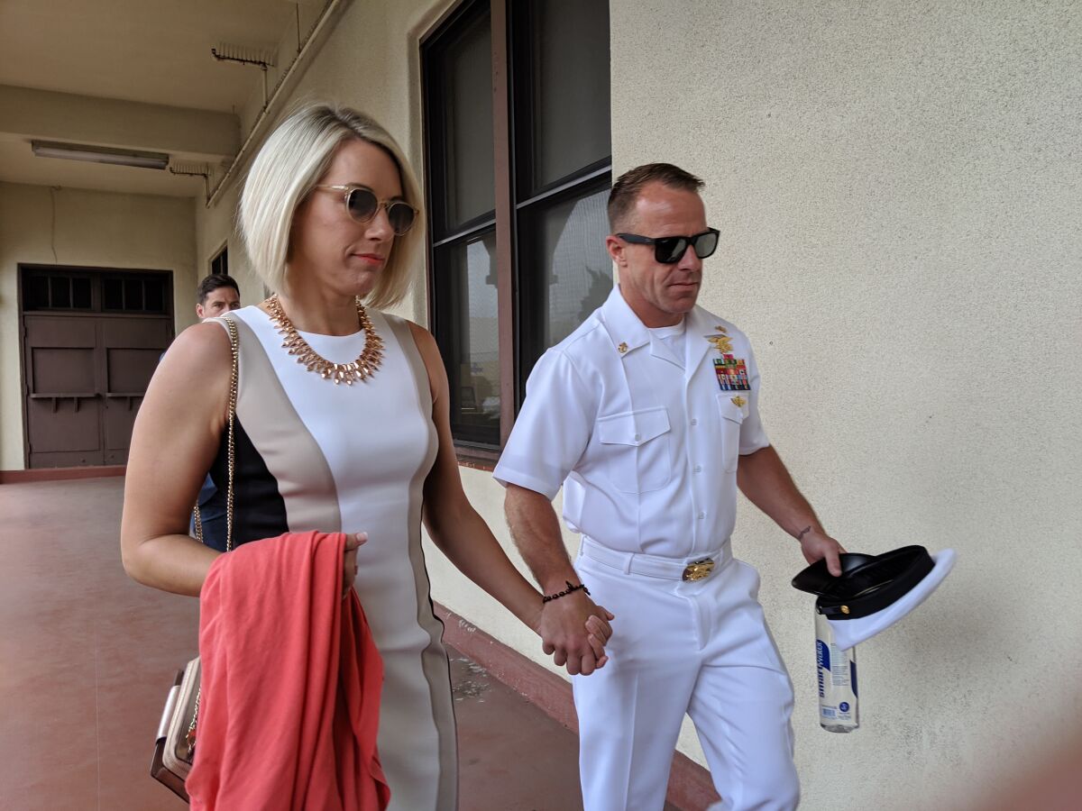 Navy SEAL Petty Officer 1st Class Edward R. Gallagher, then a chief petty officer, and wife Andrea Gallagher, leave the Naval Base San Diego court house June 18 during a break in his court martial trial. Gallagher was acquitted of all but one of his charges.