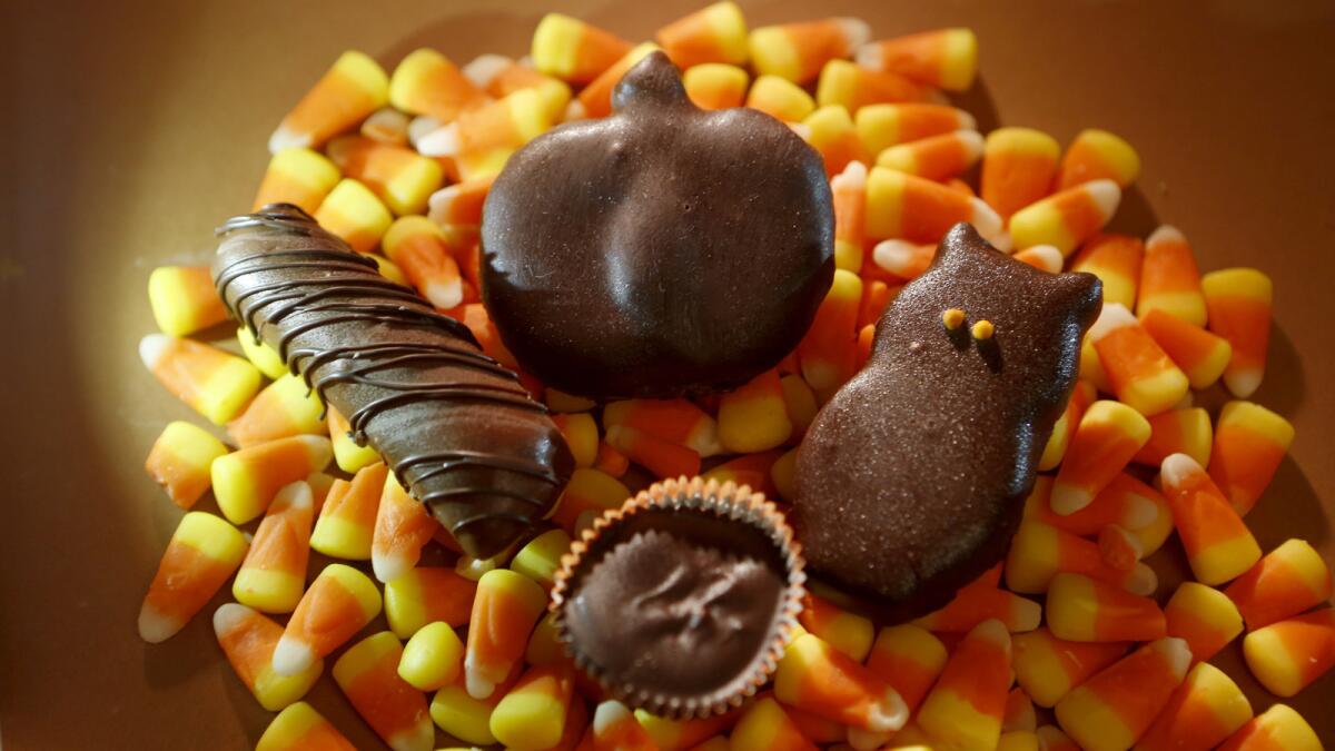 For Halloween, make your own Twix-like candy bar, clockwise from left, coconut chocolate bar, peppermint patty and peanut butter cup.