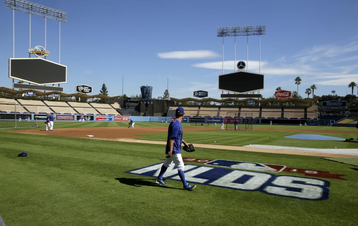 Dodgers Manager Don Mattingly watches during batting practice in preparation for the National League division series against the New York Mets that is set to begin Friday.