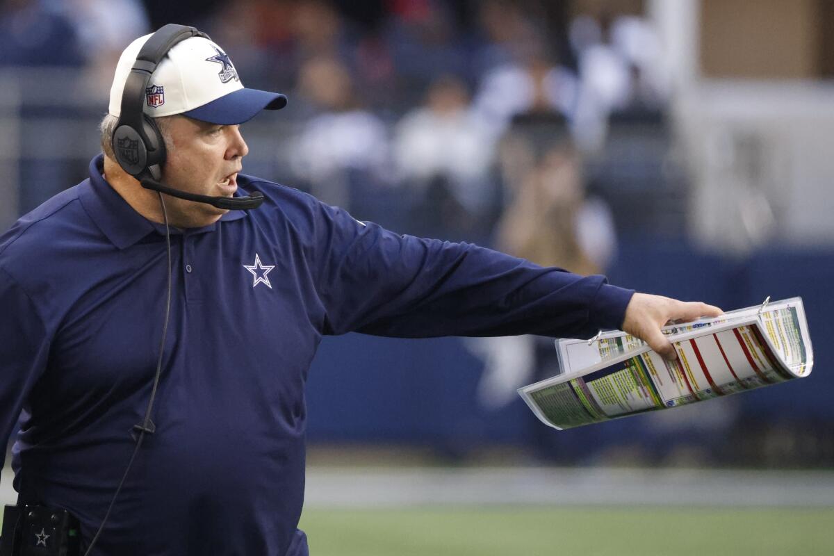 Dallas Cowboys head coach Mike McCarthy reacts during the first half of an NFL football game against the Chicago Bears Sunday, Oct. 30, 2022, in Arlington, Texas. (AP Photo/Ron Jenkins)